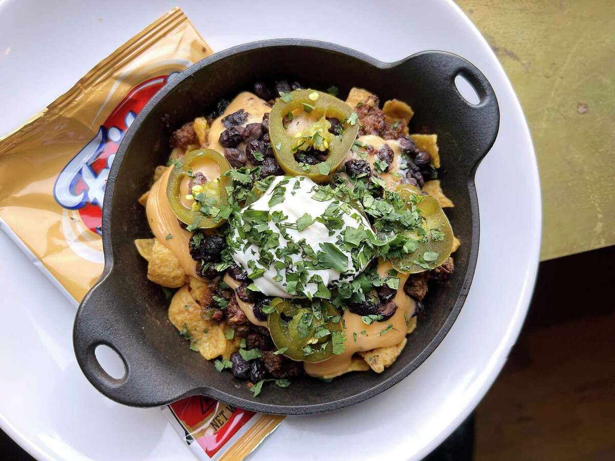 An upscale twist on Frito pie includes dry-aged rib-eye steak at Cured at the Pearl.