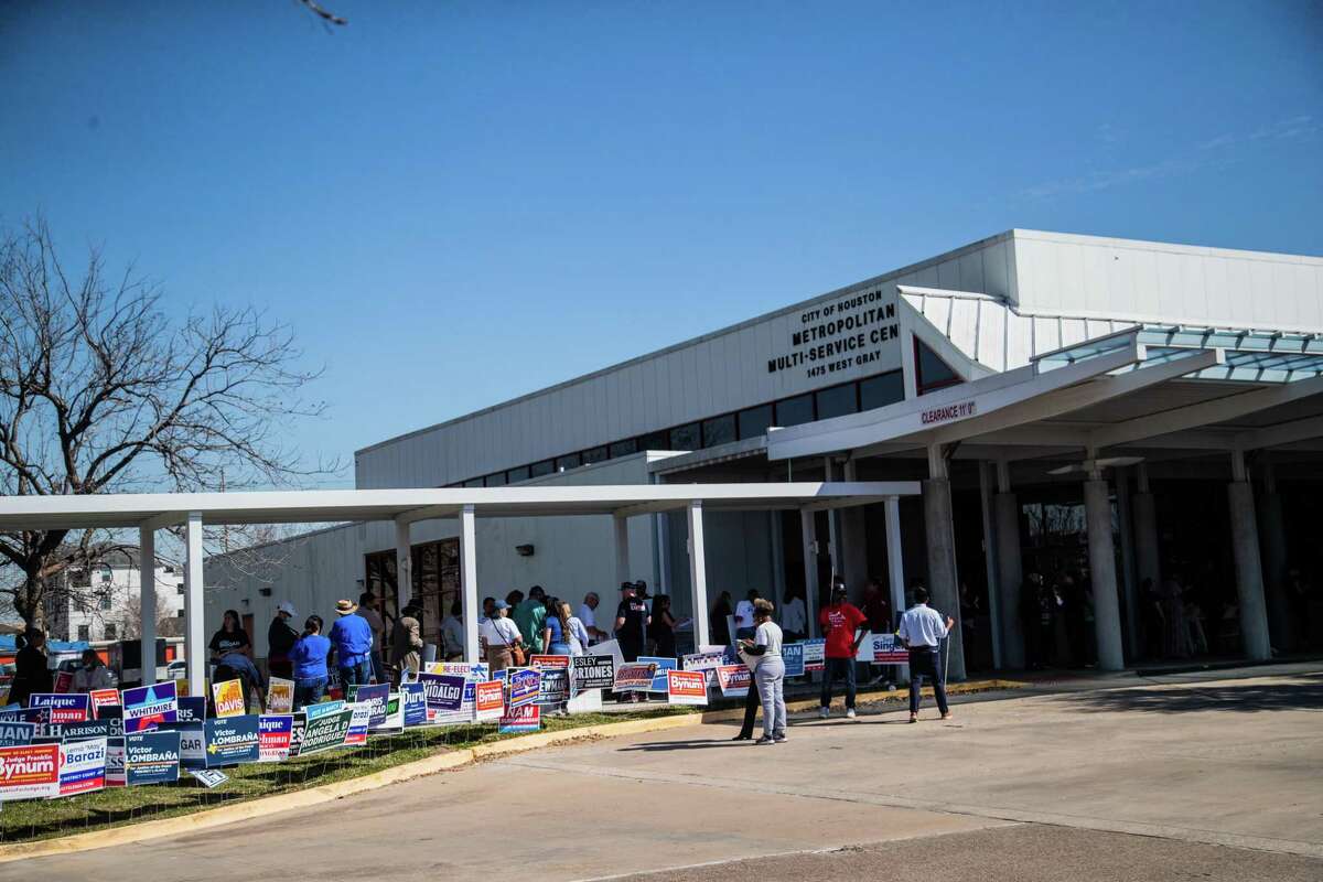 People line up to vote in the Democratic and Republican primaries at the West Gray Metropolitan Multi-Service Center on Tuesday, March 1, 2022, in Houston.