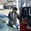 Rene Monges pumps gas for a customer at the Le Mans 24 Citgo in the Cos Cob section of Greenwich, Conn. Tuesday, March 8, 2022. Connecticut’s average gas prices hovered around $4.36 per gallon at the time, and hit $4 per gallon again Sunday, according to AAA.