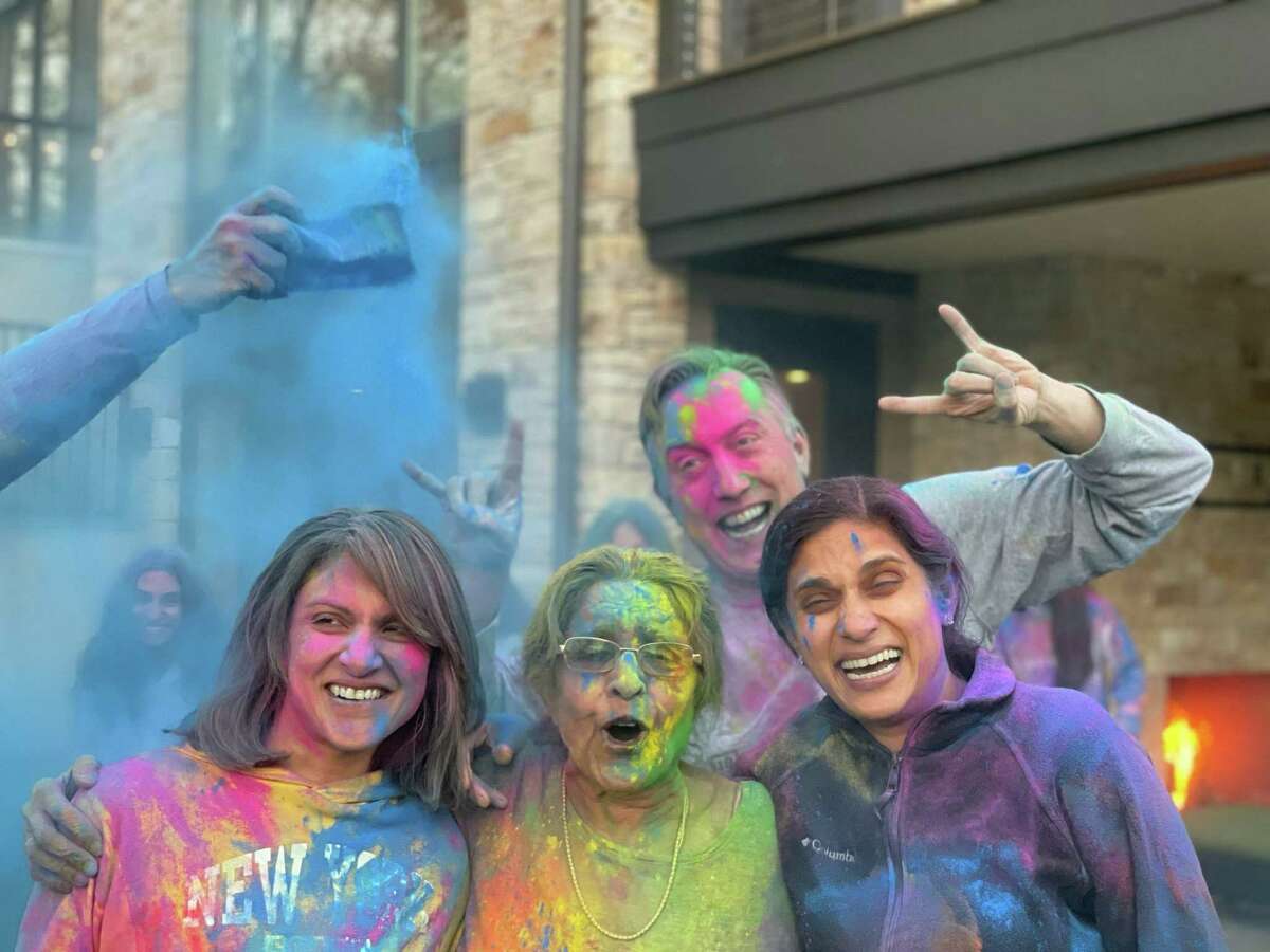 Alka Thukral, Usha Dhanalal, Valerie Jaiswal, and Drew Gilbert join in on the Holi fun at a past event.