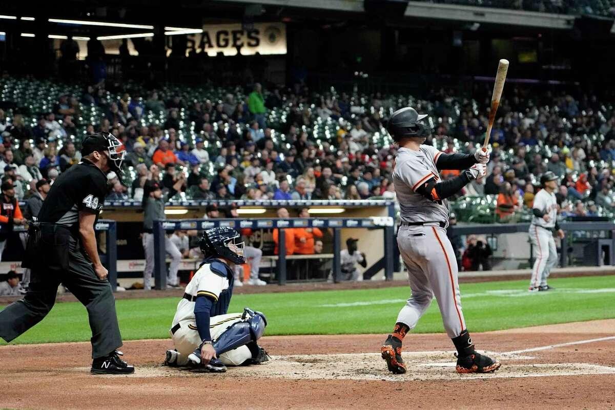 San Francisco Giants' Joc Pederson hits a two-run home run during the eighth inning of a baseball game against the Milwaukee Brewers Monday, April 25, 2022, in Milwaukee. (AP Photo/Morry Gash)