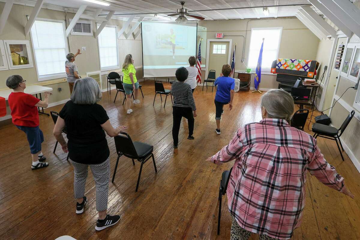 Seniors warm up April 14 with cardio dancing at the Cibolo Senior Activities Center at Cibolo Grange 1541 hall . The center, in partnership with the Comal County Senior Citizens Foundation, opened Jan. 31.