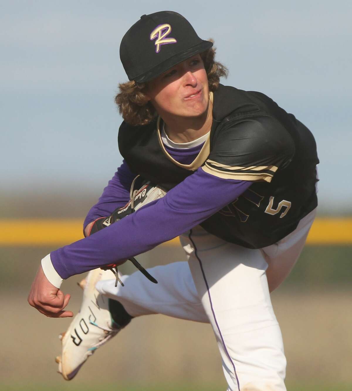 Routt's Conrad Charpentier follows through on a pitch during a game at Triopia on Monday.