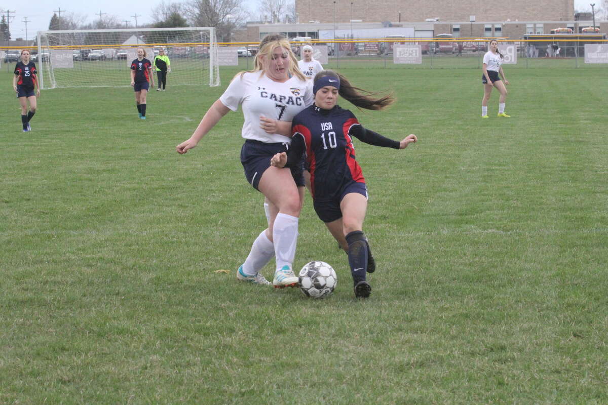 USA's Alberta Reinbold dribbling the ball against Capac Monday, April 25.