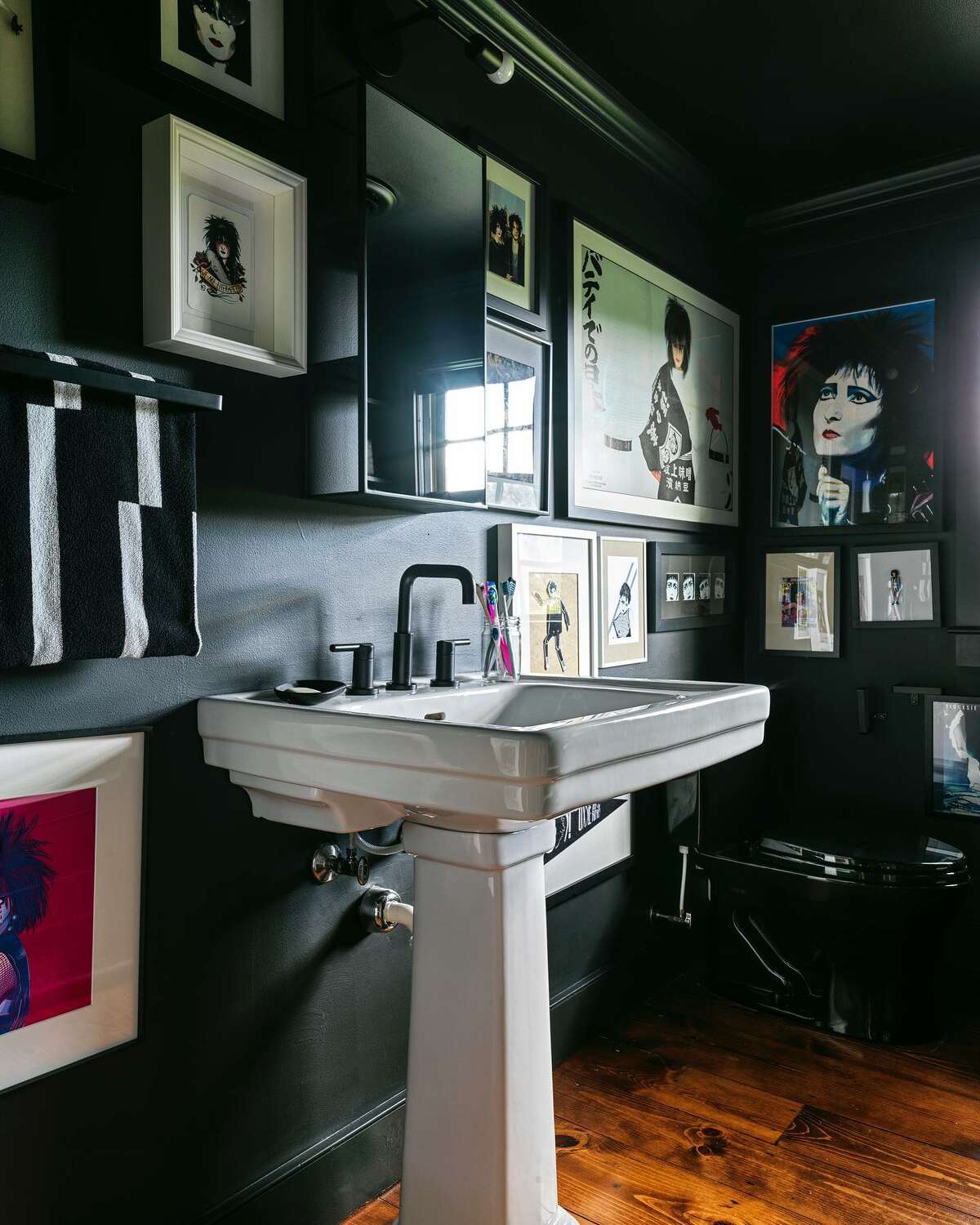 The black bathroom is an homage to British band Siouxsie and the Banshees.