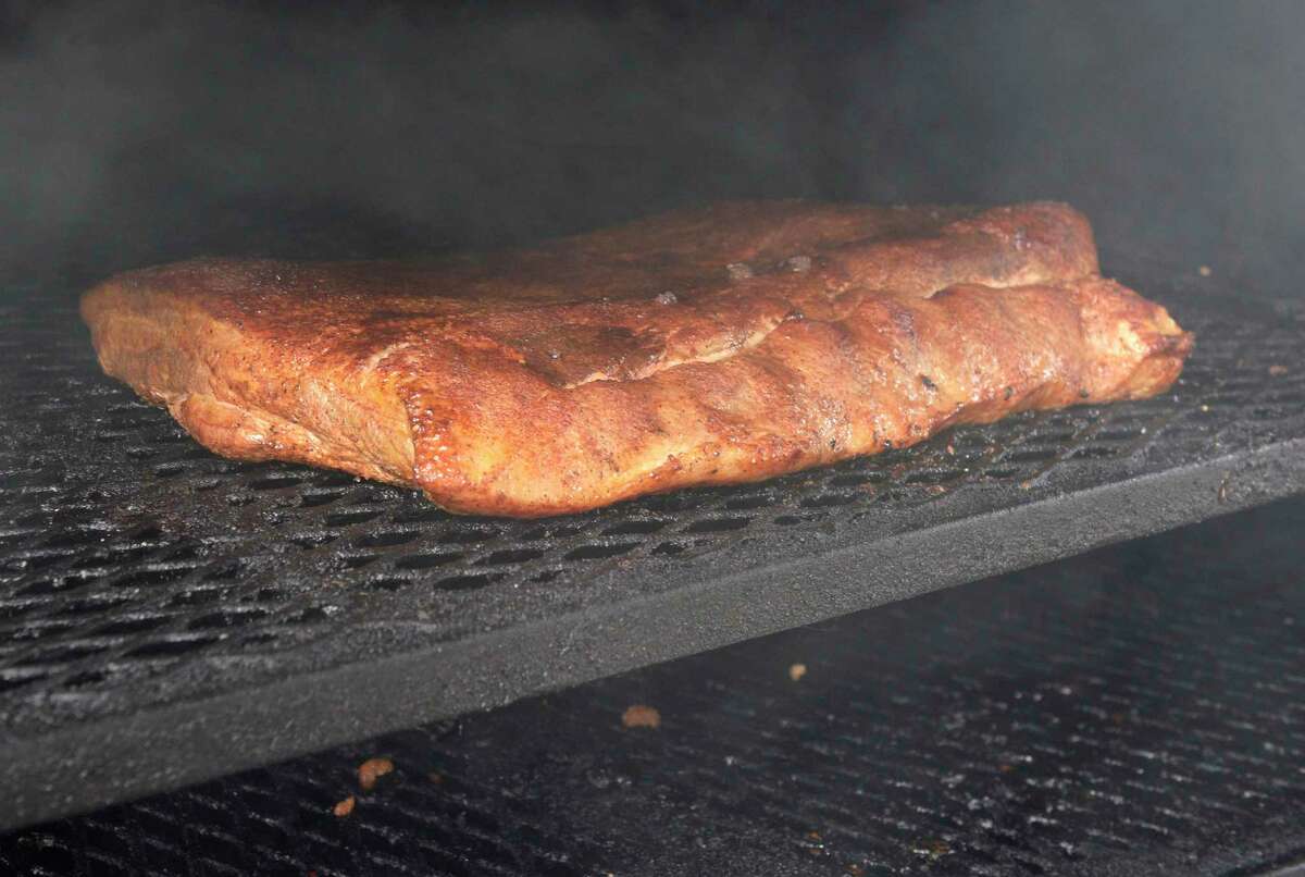 Matt Lombardo and his wife Stacey have opened Farmboys Smokin’ Bar-B-Q in Danbury. Matt is the head pit master of the restaurant and Farmboys Smokin’ Bar-B-Q catering, which they started in 2012. Monday, April 25, 2022, Danbury Conn.