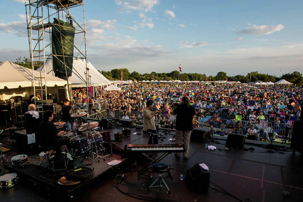(L-R) Kevin Dugan, Sam Broussard, Steve Riley and Kevin Wimmer of Steve Riley and the Mamou Playboys perform to a full crowd during the 2012 Rhythm & Roots Festival at Ninigret Park on September 2, 2012 in Charlestown, Rhode Island. 