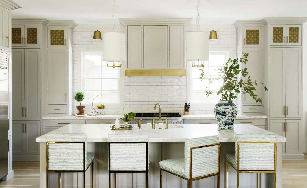 Mesh metal cabinet doors repeat from the butler’s pantry into the kitchen.