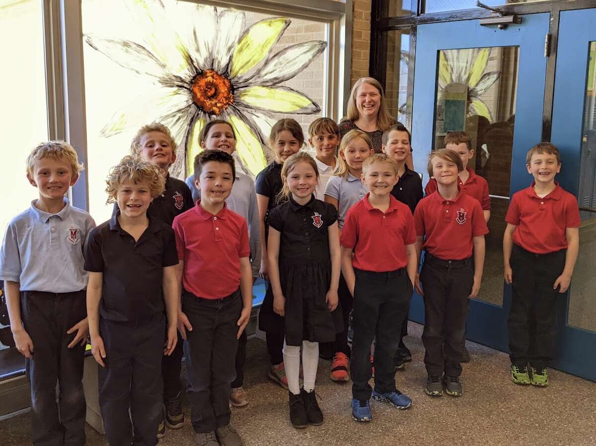 Laura Cameron's second grade class at Manistee Catholic Central earned a pizza party by raising the most money during the school's Change for Ukraine service project.
