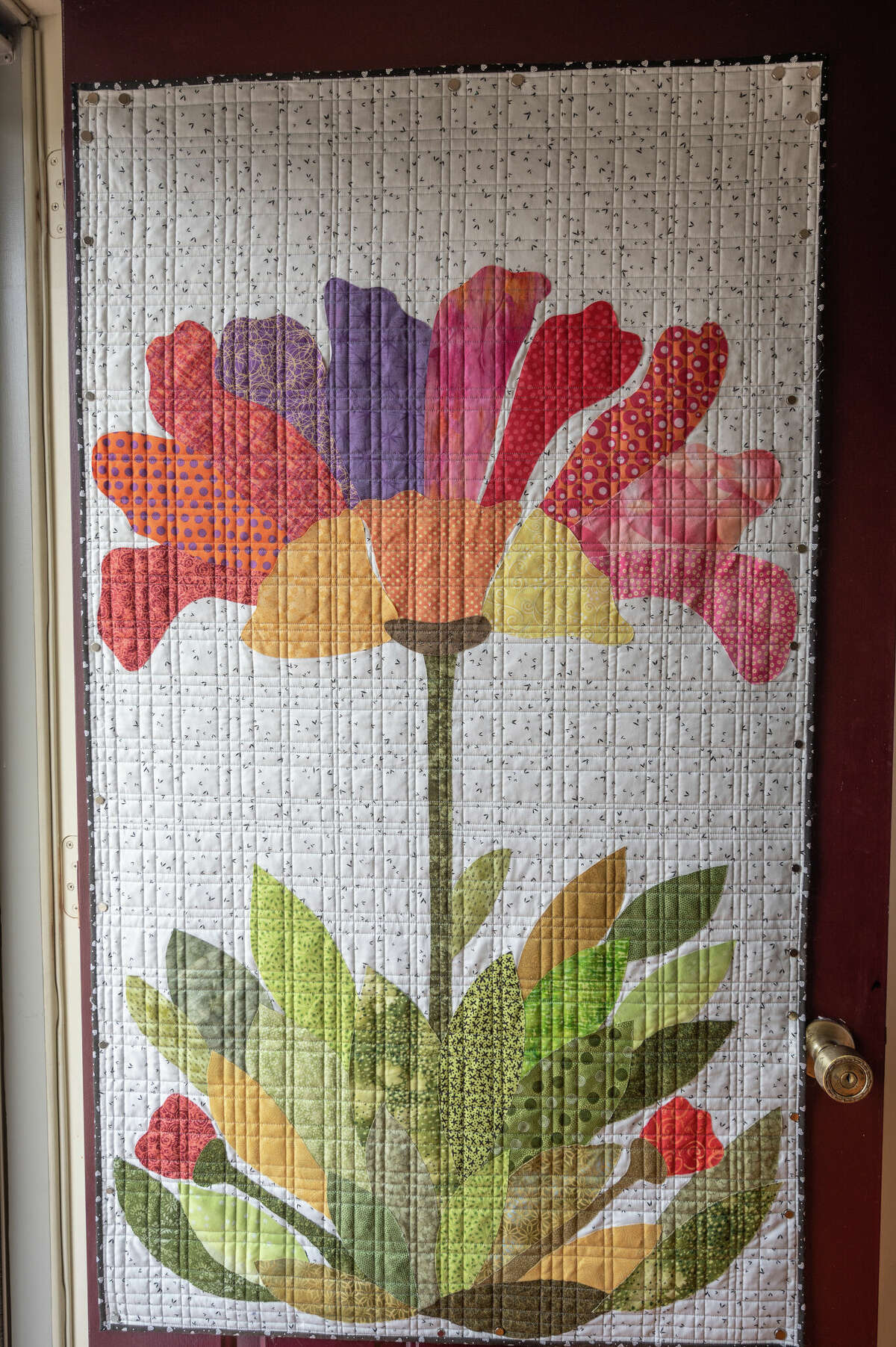 Judy Piper's front door of her Midland home is decorated with one of her quilted works. Piper and her daughter, Laura Greenfelder, are the featured quilters of this year's Midland Quilters Squared show, April 29-May 1.