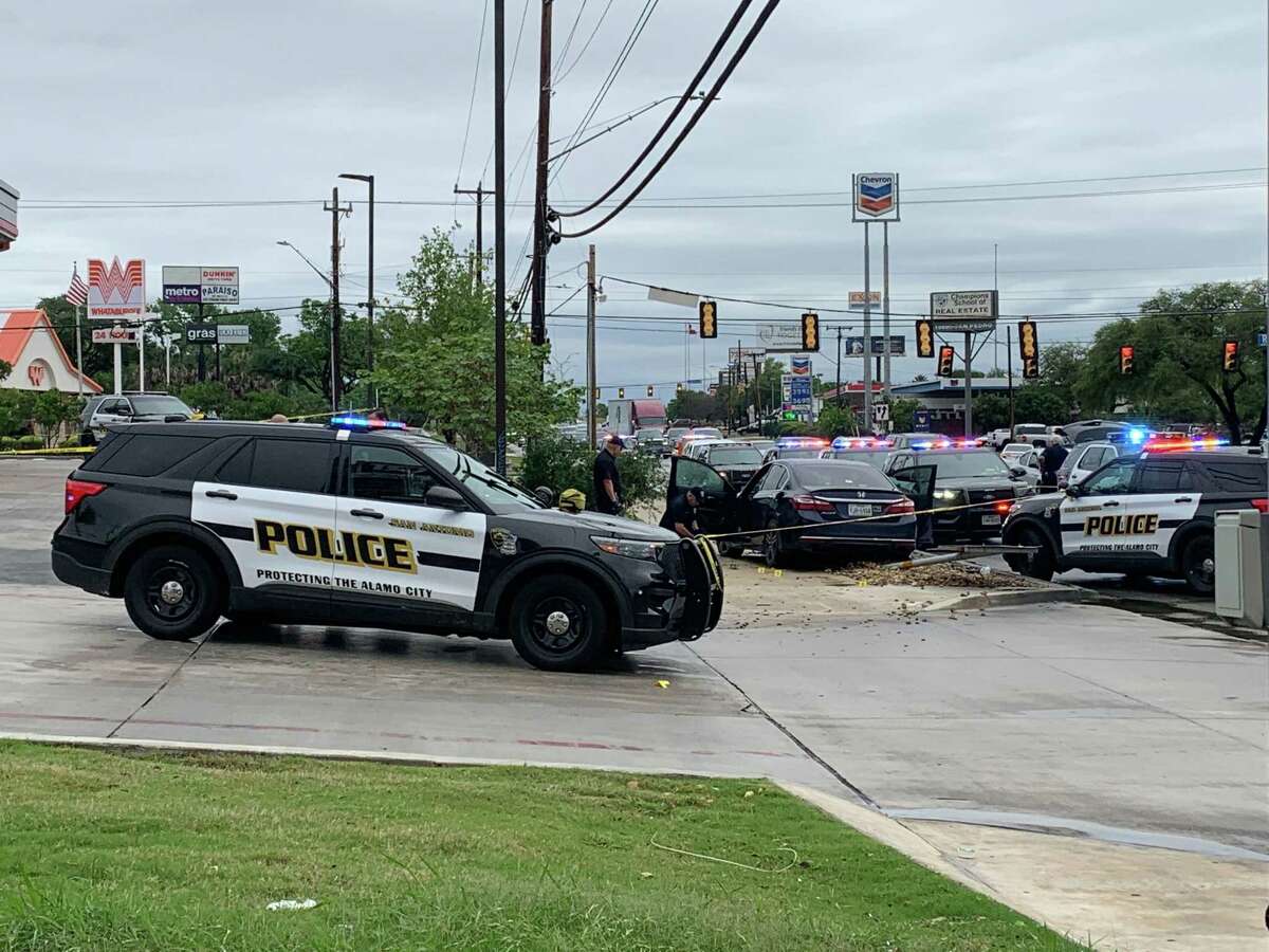San Antonio police officers investigate at the QuikTrip at 9907 San Pedro Ave., where a the owner of a Honda Accord reportedly shot a man who was attempting to steal the car on Tuesday, April 26, 2022. Neither man was identified by police at the time, and police said it’s unclear what charges either man may face.