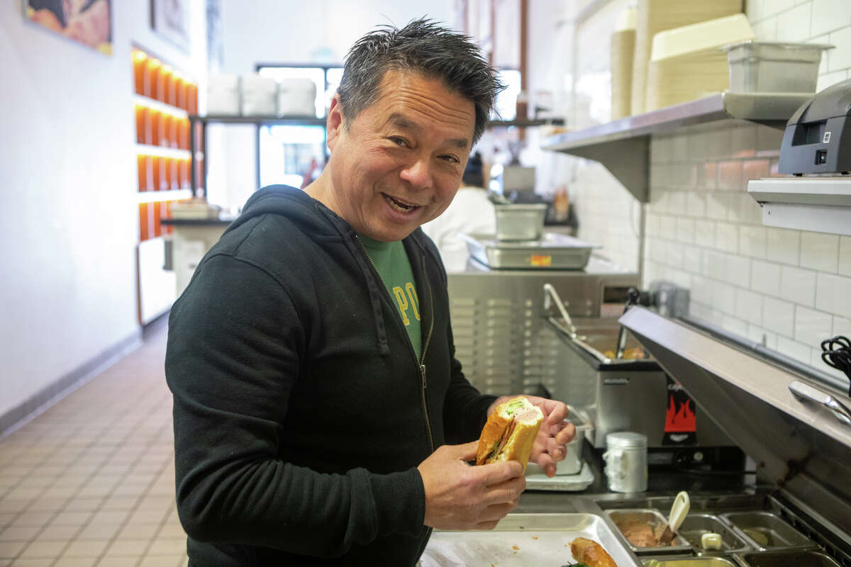 Chef Charles Phan prepares a CP's No. 3 banh mi sandwich at Chuck's Takeaway in San Francisco on Apr. 21, 2022.