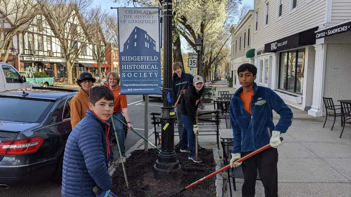 Scouts cleaned up Main Street on Saturday, April 23 in honor of Ryan Adams, a Ridgefield Eagle Scout who died at 18 in a plane crash. From left to right: Christian Thompson (in baseball cap), Ben Pearl (foreground), Henry Sullivan, Logan Tole, Declan Luham and Vishal Baskar. These scouts are from Troop 76.