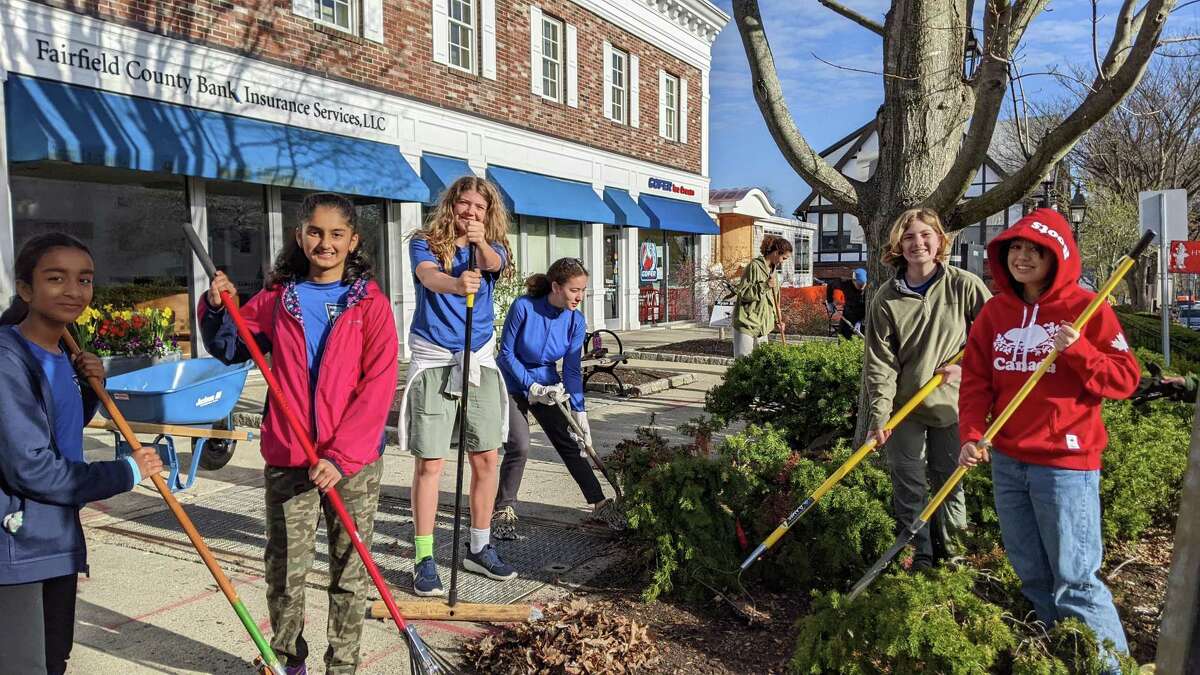Scouts cleaned up Main Street on Saturday, April 23 in honor of Ryan Adams, a Ridgefield Eagle Scout who died at 18 in a plane crash. From left to right: Nisha Sankaran, Varshitha Yanamadala, Cathryn Mills, Kristy Breslin, Eva Taleb (far back closer to Gopher ice cream) Maya Pereyra, Jordan Mooney. The scouts are in the all-girl Troop 119.
