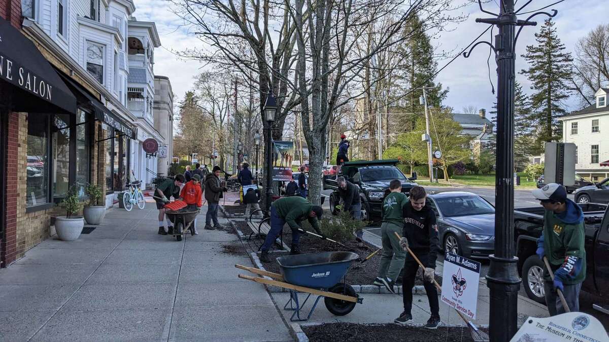 Scouts cleaned up Main Street on Saturday, April 23 in honor of Ryan Adams, a Ridgefield Eagle Scout who died at 18 in a plane crash. Scouts from Troop 116 are pictured.