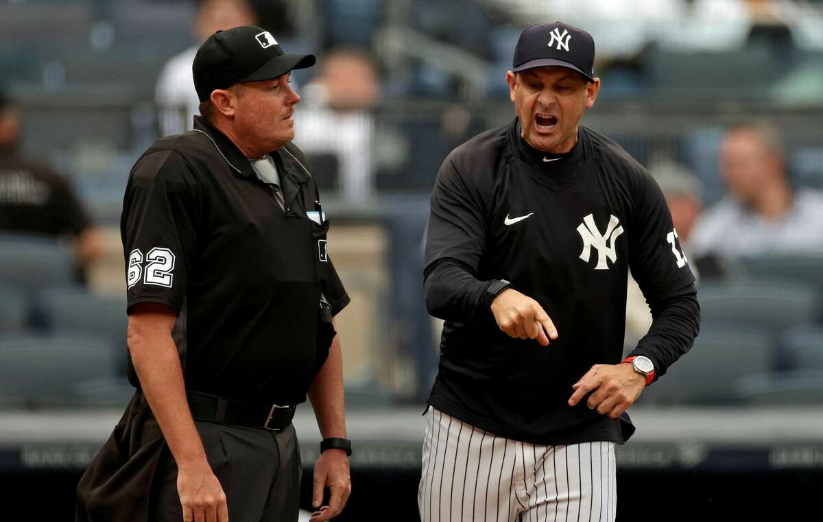 Aaron Boone of the New York Yankees argues with home plate umpire Chad Whitson after being thrown out of the game against the New York Yankees during the seventh inning at Yankee Stadium on June 3, 2021 in the Bronx.