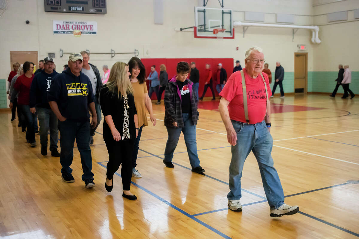 Dar Grove marks his 89th birthday Tuesday, April 26, 2022 by completing his 2,000th mile at the Beaverton Activity Center, with an entourage of fans walking with him.