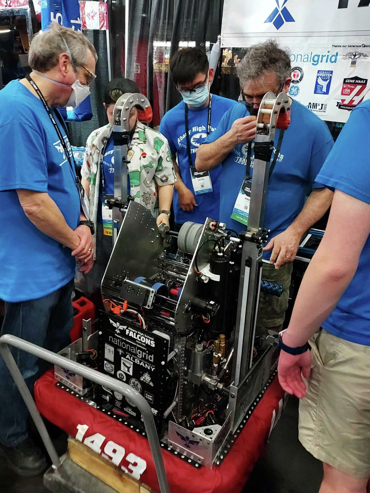 The Albany Robotics Team prepares their robot for a match at the championship in Houston.