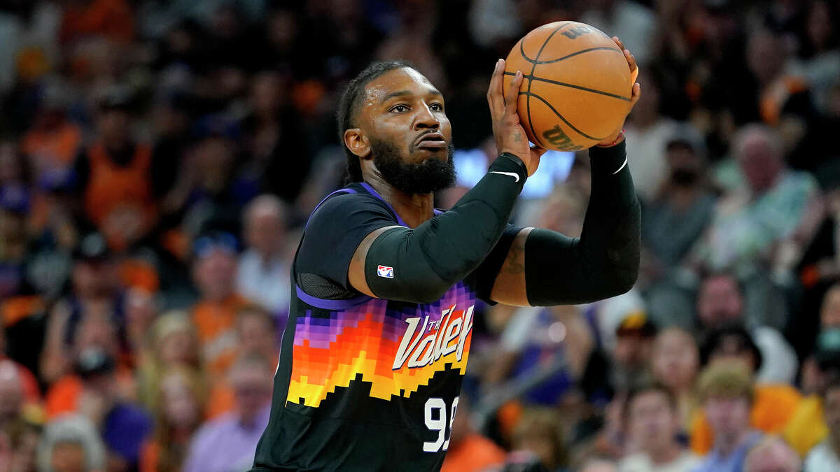 Phoenix Suns forward Jae Crowder (99) shoots against the New Orleans Pelicans during the first half of Game 1 of an NBA basketball first-round playoff series, Sunday, April 17, 2022, in Phoenix. 