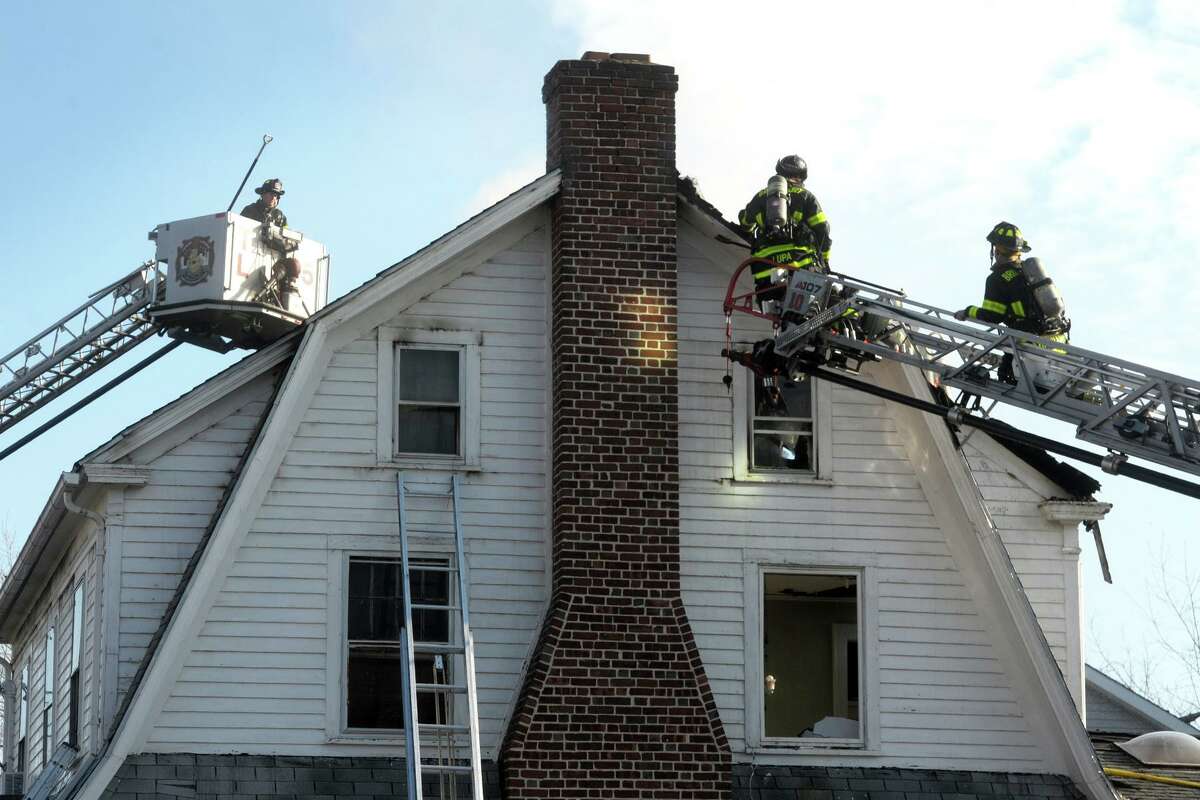 Firefighters at the scene following a fire in a home on Ochsner Place Jan. 12, 2021.