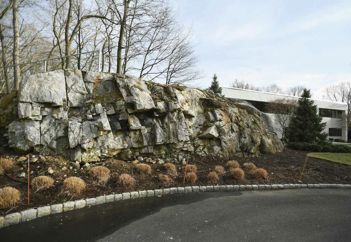A giant rock outcrop is scheduled to be blasted to allow construction of an access road for the newly approved sixty unit apartment complex scheduled to begin construction this fall on the 3 Parklands Drive property in Darien, Conn. on Thursday, February 17, 2022.