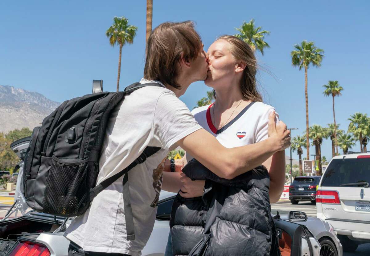 Anton and Julia embrace at Palm Springs International Airport one day after Anton’s release from an immigrant detention center in Mississippi and weeks after the married Russian couple last saw each other.