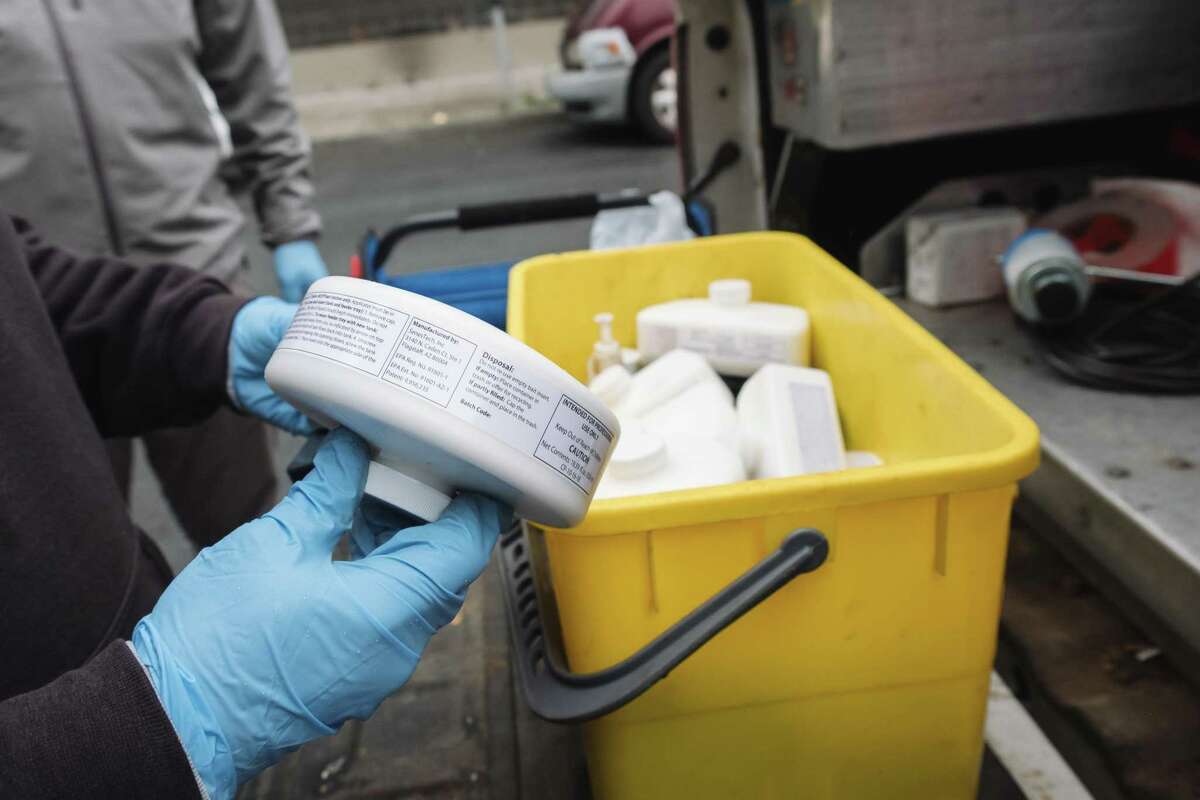 Zach Goetschi sets up the new rat contraceptive bait at KidsPower Park. San Francisco CA, Thursday, Apr. 14, 2022. The City has chosen a new contraceptive bait that will slow down the growth of its rat population.