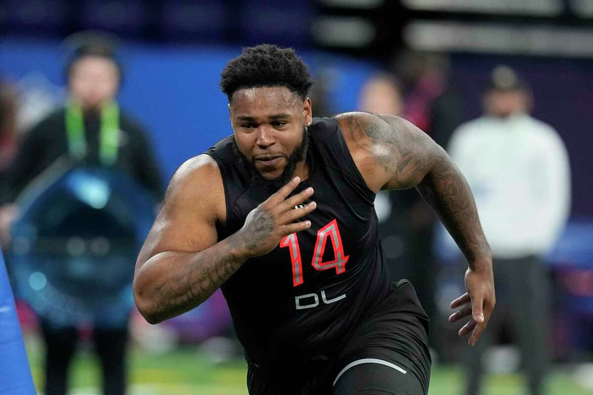 UConn defensive lineman Travis Jones runs a drill during the NFL football scouting combine on March 5 in Indianapolis. Jones is a possible pick in the NFL Draft.