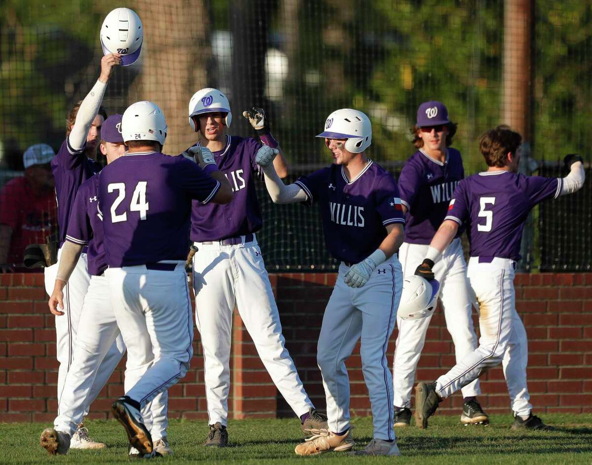 Willis players celebrate after Marshal Neiderhofer’s sac-fly scored Aiden Slott during the first inning of a District 13-6A high school baseball game at Conroe High School, Tuesday, April 26, 2022, in Conroe.