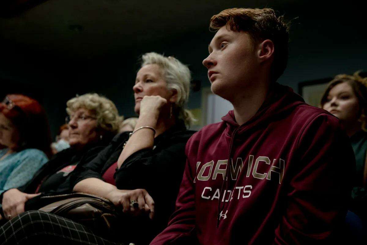 Seth Varin, right, sits with other Killingly residents after giving a public comment to support a free mental health clinic. "I believe you are missing out on a great opportunity to save lives," Varin said.