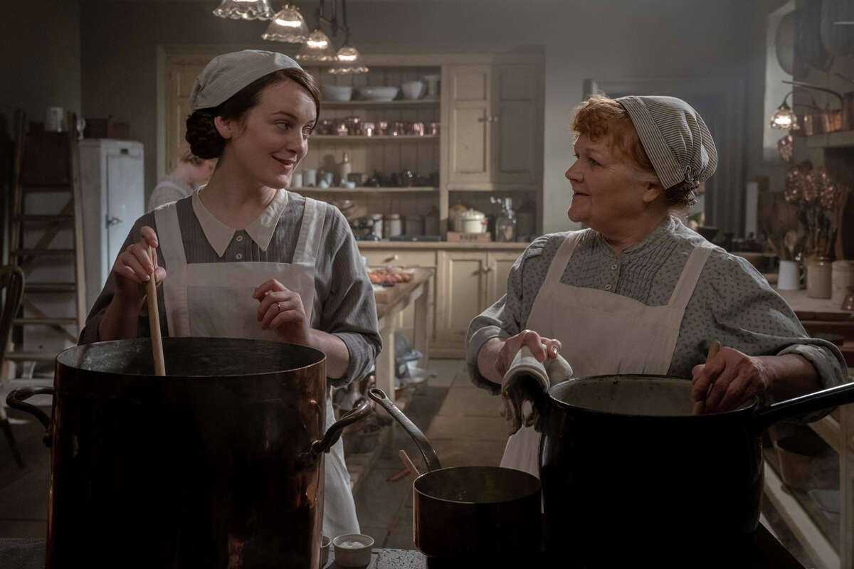 Sophie McShera (left) stars as Daisy and Lesley Nicol stars as Mrs. Patmore in "Downton Abbey: A New Era."