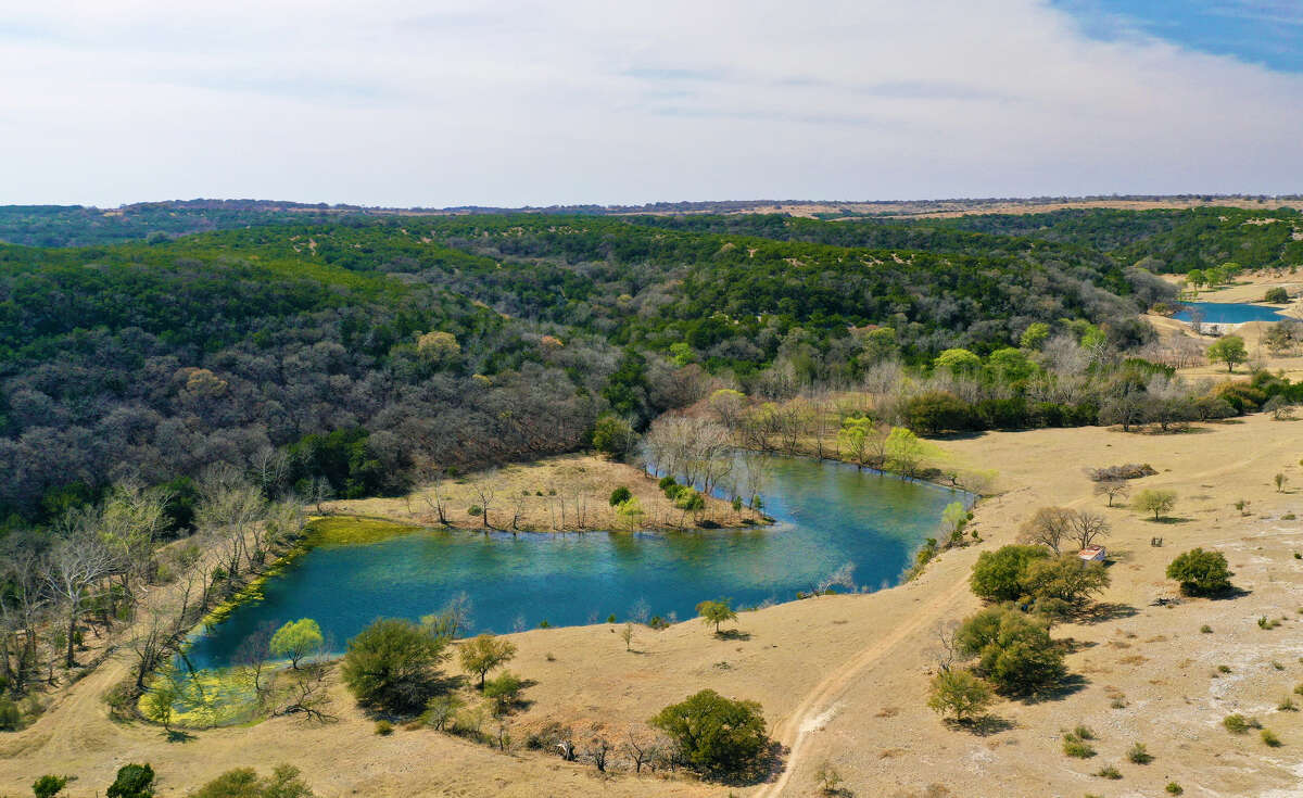 The Less Ranch, a 2,269-acre tract of land just off Texas 46 comes with creeks, springs and a "dramatic cave" has hit the market for $54 million, according to a listing by Robert Dullnig of Dullnig Ranch Sales. 