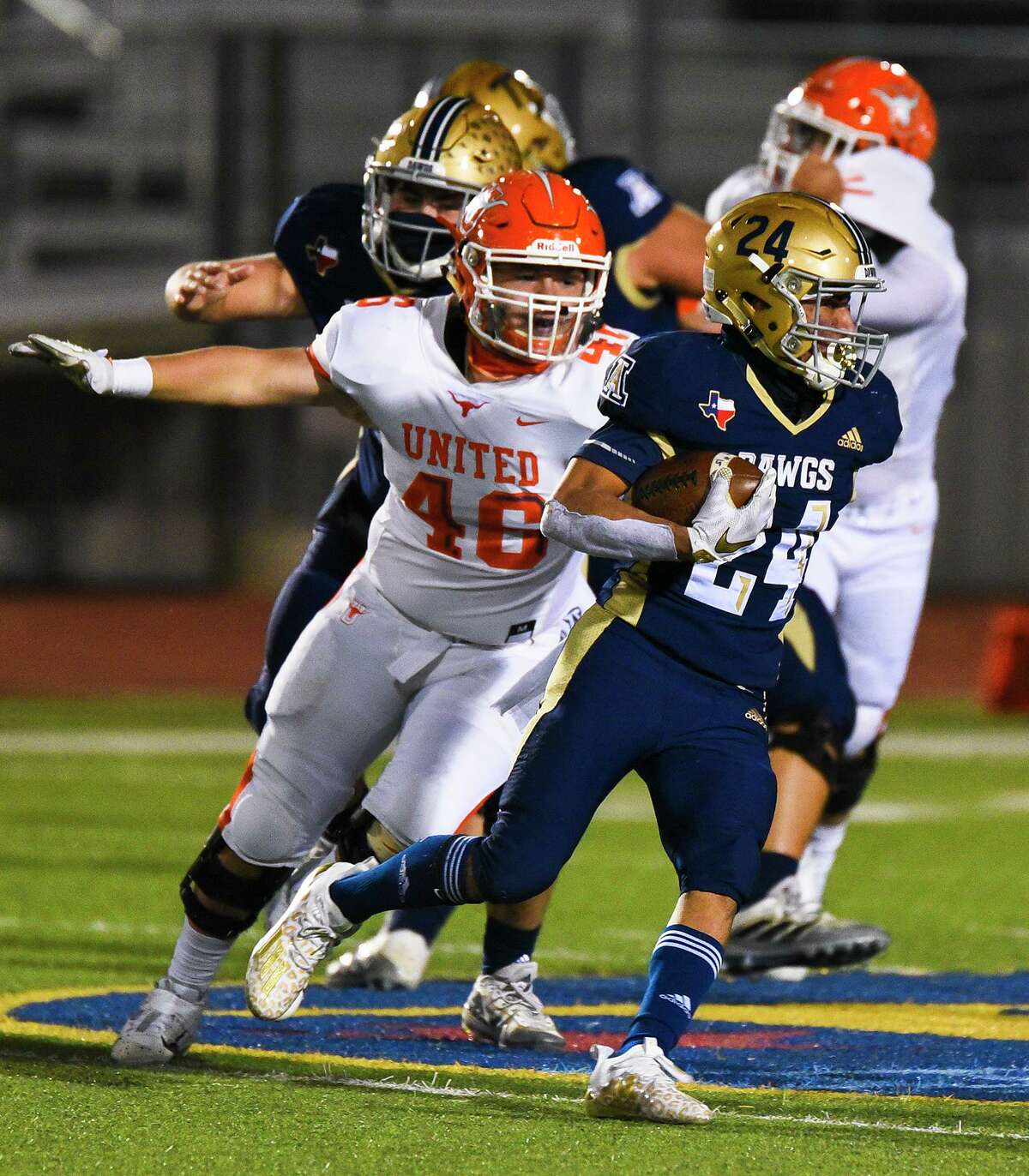 Alexander High School’s Gael Rodriguez runs the ball as United High School’s Gael Soto closes in for the tackle, Friday, Dec. 4, 2020, at the UISD Student Activity Complex. Soto is among three All-District performers returning to the Longhorns’ defensive line next season.
