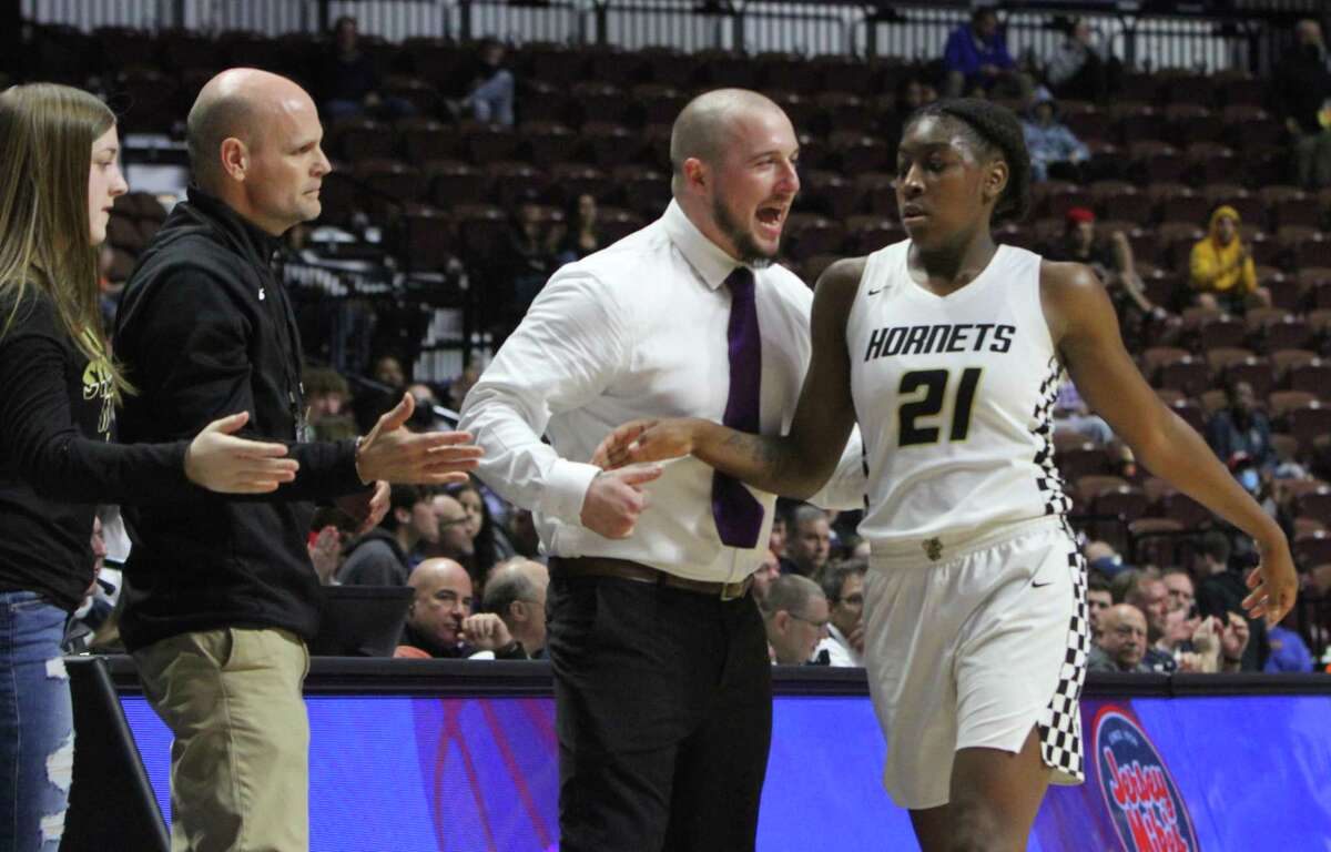 Shailyn Pinkney is congratulated by East Hartford coach Jonathan Myette as she left the court for the final timeagainst Wilton during the CIAC Class LL finals at Mohegan Sun Arena. Pinkney, the GameTimeCT State Player of the Year, averaged 23 points, 10 rebounds, 4 assists and 4 steals per game.