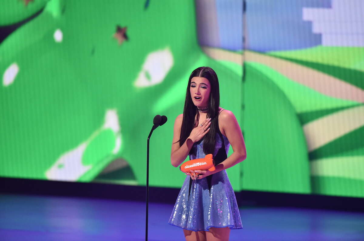 Charli D'Amelio accepts the Favorite Female Creator award onstage during the 2022 Nickelodeon Kid's Choice Awards at Barker Hangar on April 09, 2022 in Santa Monica, California. 