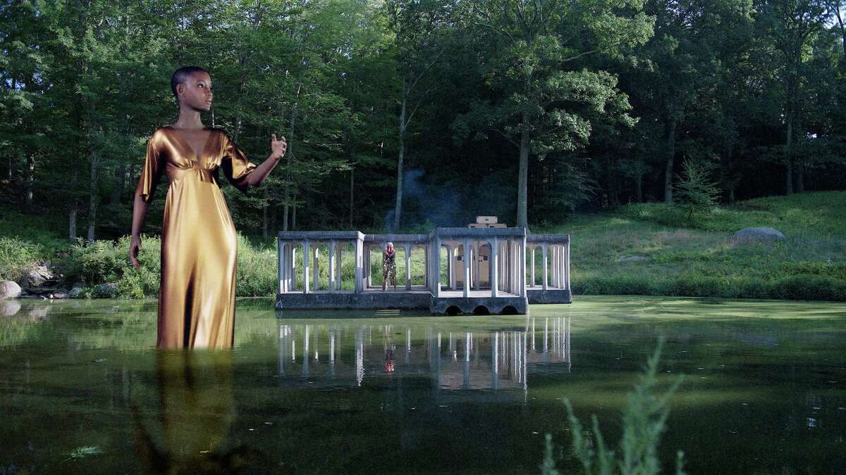 The Glass House is featuring three prominent Black artists this season, including a showing of a film in the Painting Gallery which uses software employed in video games. In it, a giant woman dressed in gold is standing in front of the Pavilion on the Pond on the 49-acre site in New Canaan. The film was created by David Hartt and cellist Tomeka Reid.
