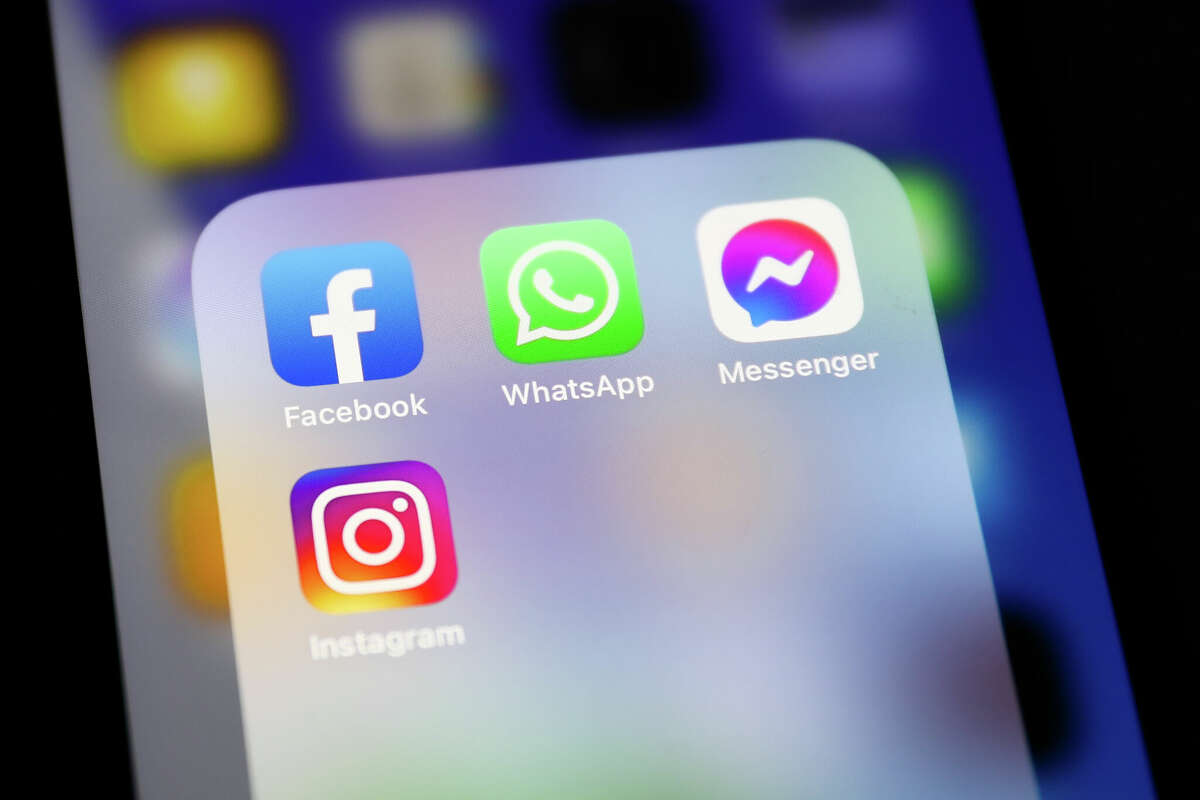 Facebook, WhatsApp, Messenger and Instagram icons displayed on a phone screen are seen in this illustration photo taken in Krakow, Poland on April 6, 2022. (Photo by Jakub Porzycki/NurPhoto via Getty Images)