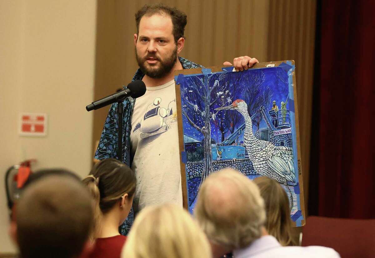 Artist Daniel Armstrong shows a drawing depicting the plight of birds in Brackenridge Park at a public meeting hosted on April 26 by the San Antonio Parks and Recreation and Public Works departments regarding a controversial Brackenridge Park project.