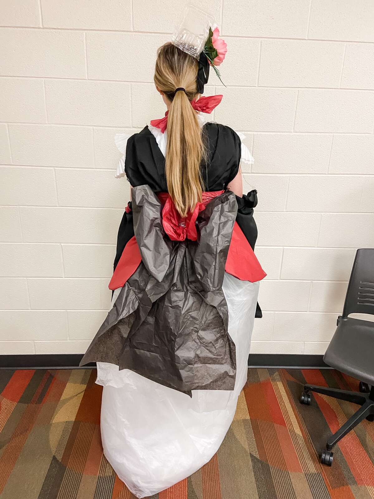 Big Rapids students Corbin Richeson, Paisley Prosser, and Abbie Strasser participated and made a fashion statement by turning different textiles and trash items into a wearable gown.
