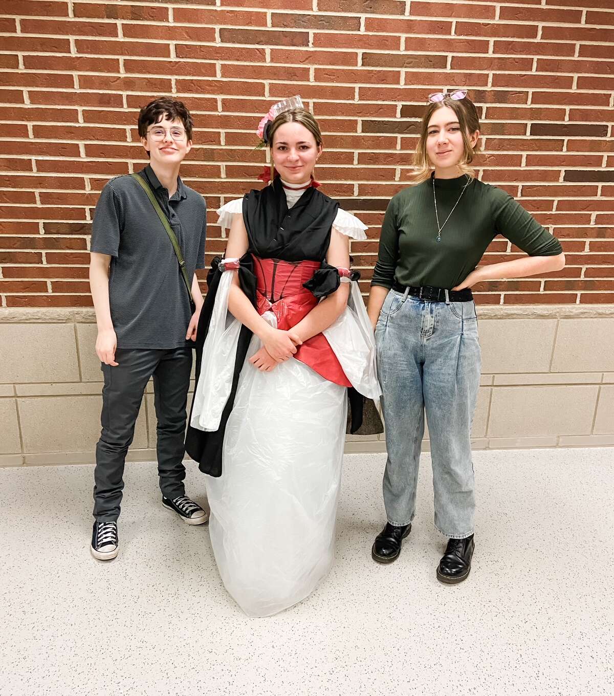 Big Rapids students Corbin Richeson, Paisley Prosser, and Abbie Strasser participated and made a fashion statement by turning different textiles and trash items into a wearable gown.