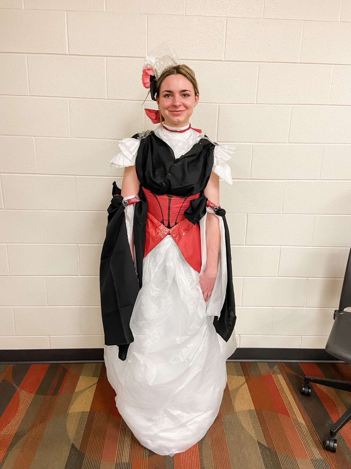 Big Rapids students Corbin Richeson, Paisley Prosser, and Abbie Strasser participated and made a fashion statement by turning different textiles and trash items into a wearable gown.