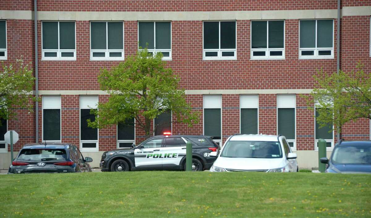 New Milford Police vehicle in front of New Milford High School, Wednesday, April 27, 2022, New Milford, Conn.