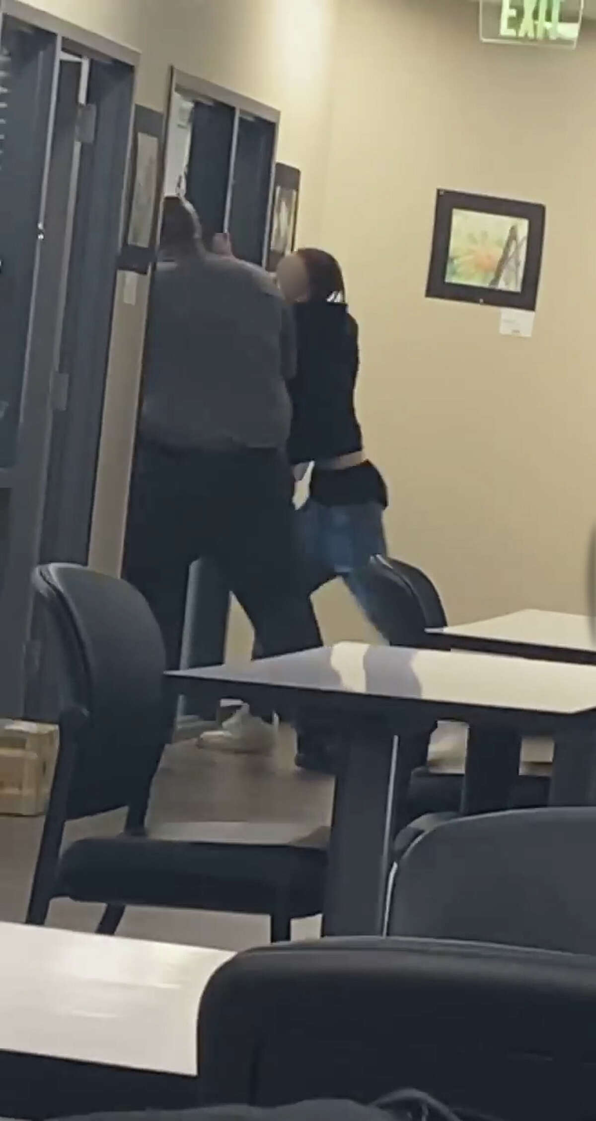 William Jeffery, left, principal of Columbia High School in Brazoria County, is seen pushing a student in a video that has been widely shared on social media. 