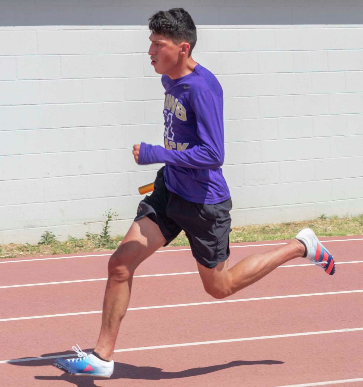 Midland High's Daniel Villegas, who has recorded the fastest time in the 400 meter race in Region 1-6A, runs practice 04/27/2022 at Memorial Stadium. Tim Fischer/Reporter-Telegram