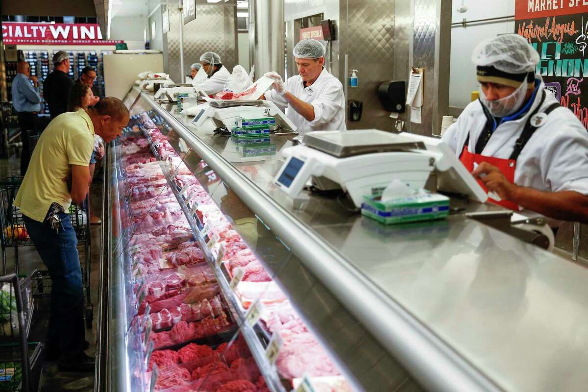 Shoppers are helped at the meat counter at Central Market in Houston. The H-E-B owned chain last week launched a new concept for a meat counter — one without meat.