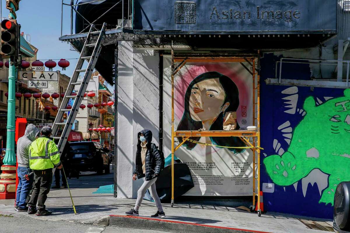 A mural painted by collaborating artists Bijun Liang and Yumei Hou covers a wall on Grant Avenue in San Francisco’s Chinatown.