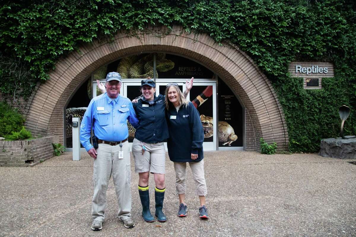Houston Zoo staff members Stan Mays, 68, his wife, Phyllis Pietrucha-Mays, right, 63, and their daughter, Memory Mays, center, 31, have been working together at the zoo for many years. Portrait taken by the reptiles exhibition, Tuesday, April 26, 2022, in Houston.
