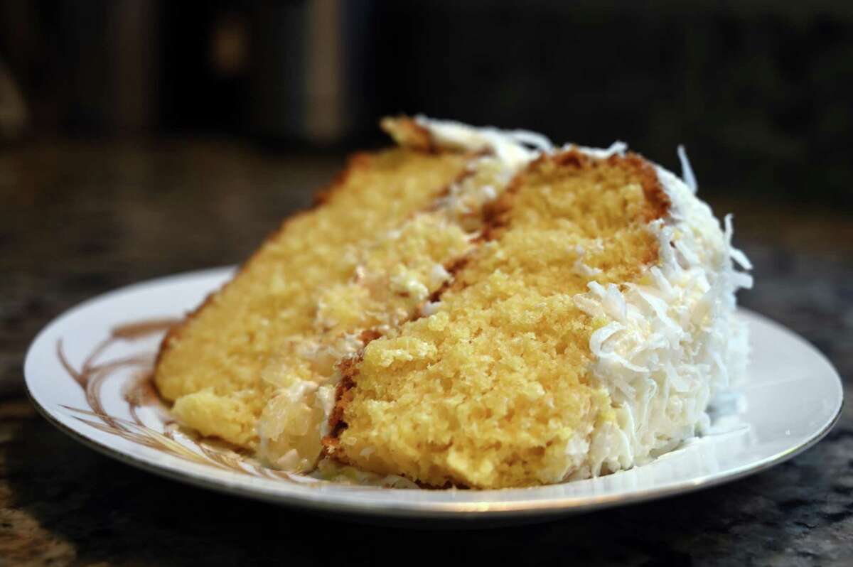 A slice of coconut cake with lemon fillng at the home food bakery Nunu’s Desserts with Soul in Vallejo.