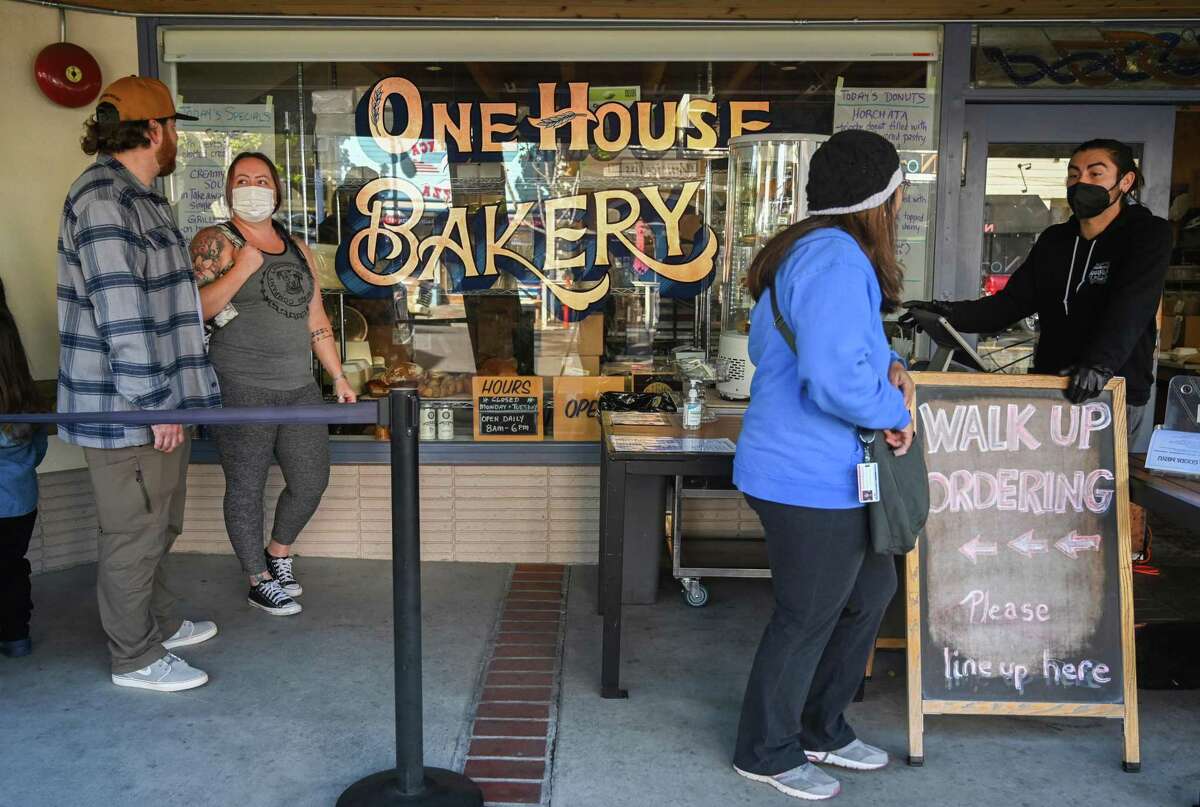 Customers line up at One House Bakery for fresh baked goods in Benicia.