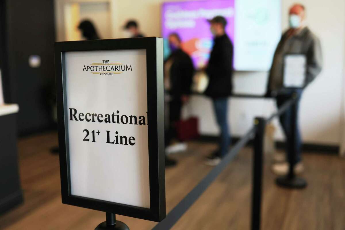 The first five customers wait in line to enter Apothecarium Dispensary on April 21, 2022, in Maplewood, New Jersey. Dispensaries like this one may open in Connecticut soon for sale of recreational marijuana.
